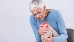 Senior,Woman,Holding,The,Knee,With,Pain.,Old,Age,,Health