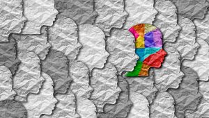 Autism syndrome person and Autistic social developmental education disorder puzzle children symbol as a child special learning icon as jigsaw pieces coming together to form a young student head in a 3D illustration.