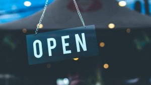 Open sign in the retail store. Bali island.