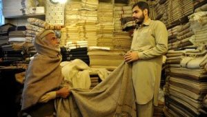 Mandatory Credit: Photo by ARSHAD ARBAB/EPA-EFE/Shutterstock (11721800c)
A Pakistani man sells traditional Chitrali woolen blankets as winter season begins, in Peshawar, 22 January 2021. People use the Chitrali woolen blanket to cover themselves to beat the cold winter.
Traditional Chitrali woolen blankets in Pakistan, Peshawar - 22 Jan 2021