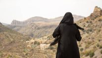 Woman wearing abaya and sheila in Oman