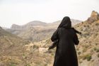Woman wearing abaya and sheila in Oman